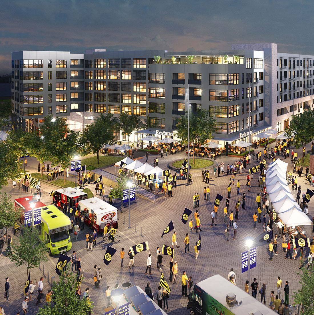 Evening scene of a bustling plaza surrounded by modern mid-rise buildings. The area features food trucks, white vendor tents, and crowds of people waving yellow and black flags, indicating a lively pre- or post-game gathering near the stadium.