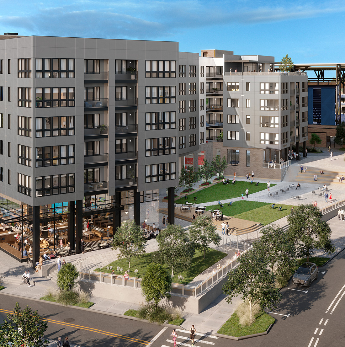 Rendering of a modern mixed-use apartment complex with ground-floor retail and dining spaces. The surrounding area includes landscaped green spaces, outdoor seating, and people walking or sitting. The multi-story buildings feature large windows and balconies, set against a clear blue sky in an active urban environment.