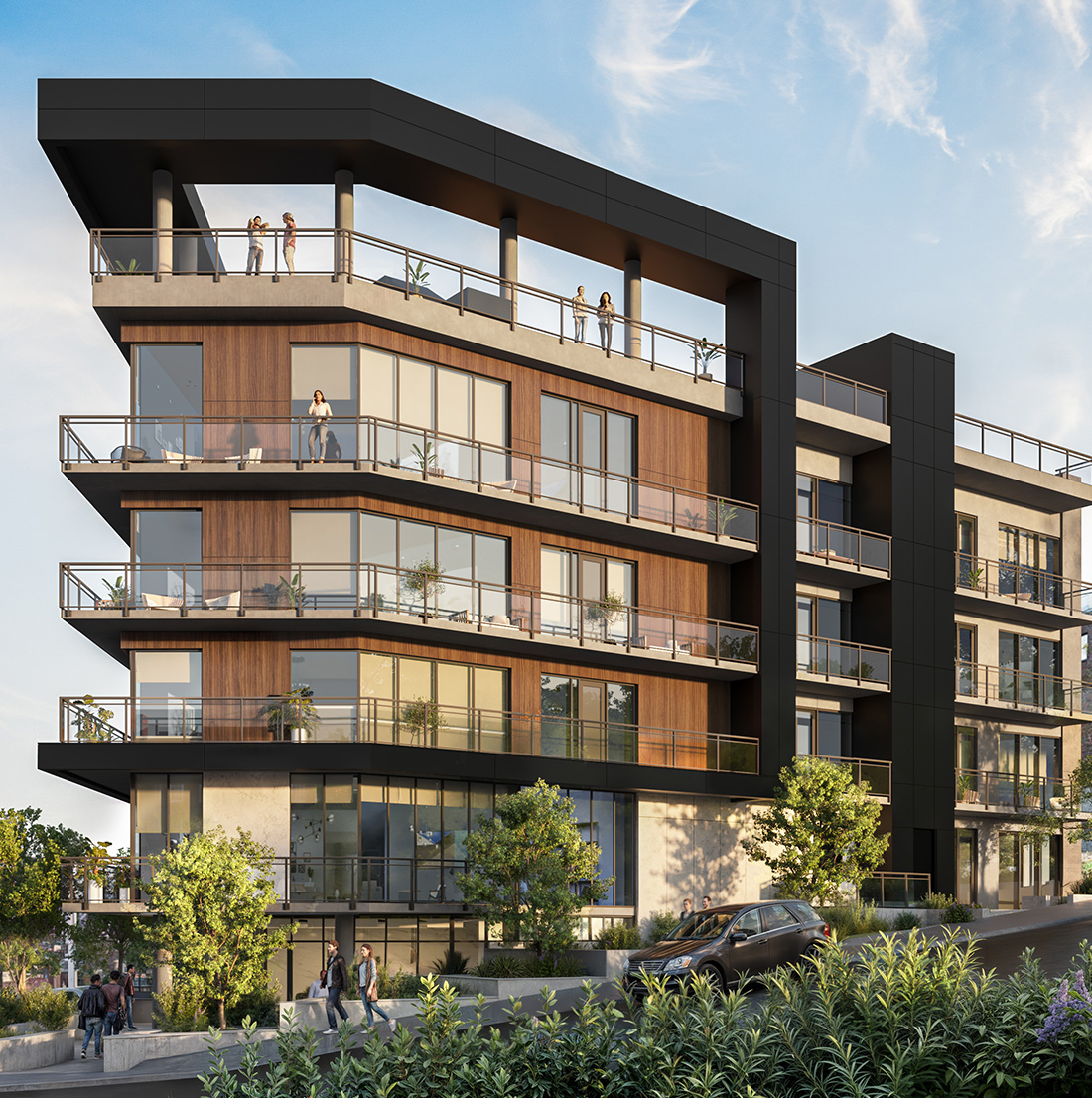 A modern mid-rise apartment building with large glass windows, wood paneling, and black architectural framing stands on a sloped street. Multiple balconies with glass railings are visible, and several people are seen enjoying the rooftop terrace and private balconies. Trees, plants, and a parked car line the street in front, with pedestrians walking along the sidewalk.