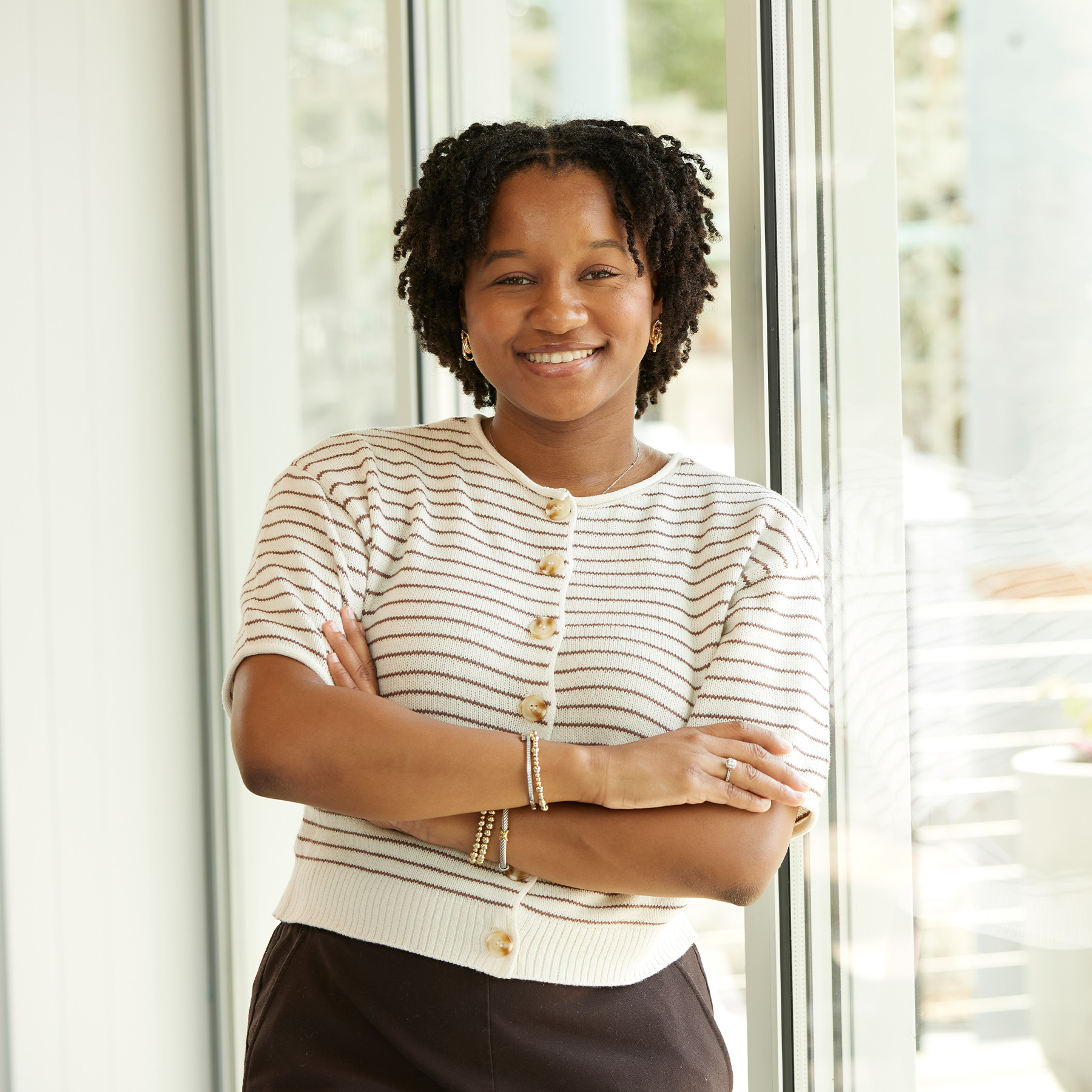 Jayden Woullard's headshot in the Smith Gee Studio office.