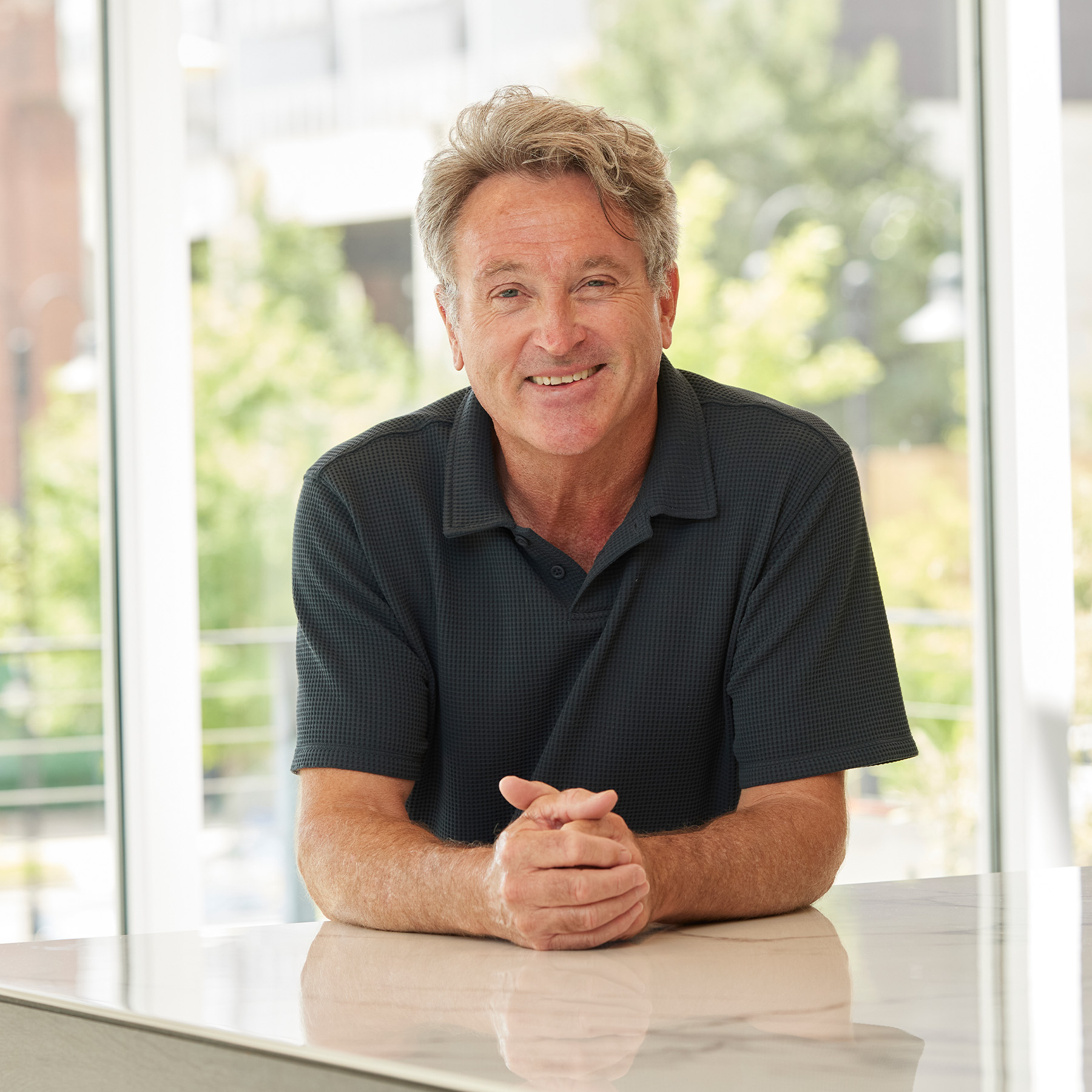 Mike Drake's headshot in the Smith Gee Studio office.